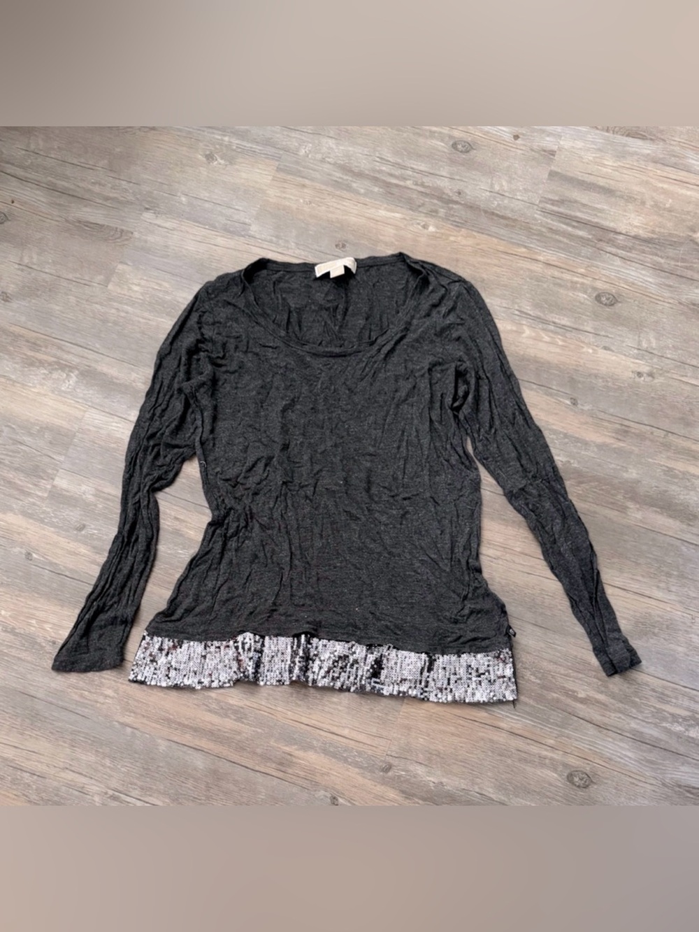 Michael Kors m long-sleeve top featuring a silver sequined hemline panel.
